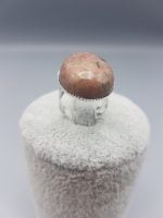 OVAL RHODONITE RING 25X18 with pink stone on white background.