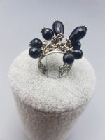 A ring with black onyx charms