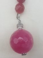 A RUBY JADE KEYCHAIN pink and silver with pink stone.
