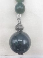 A MUSKY AGATE KEYCHAIN with green jade beads and silver chain.