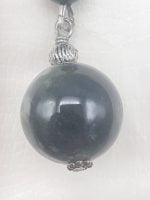A KEYCHAIN WITH MUSKY AGATE pendant from a silver pearl.