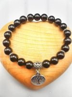 A black onyx bracelet with a silver pendant named BLACK ONYX BRACELET WITH TREE OF LIFE.