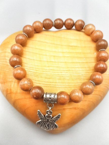 A wooden bracelet with a monkey pendant.