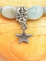 An amazonite bracelet with a star pendant.