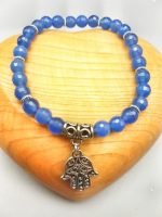 A 6mm blue agate bracelet with a silver hand of Fatima pendant.