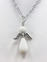 A WHITE AGATE ANGEL PENDANT on a silver chain.
