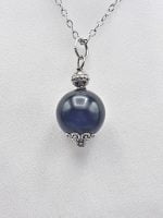 SPHERICAL BLACK ONYX PENDANT in sterling silver with blue onyx stone.
