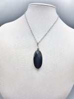 A mannequin showing a necklace OVAL BLACK ONYX PENDANT - oval shaped - with black BLACK ONYX stone.