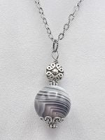 Sterling silver necklace with Spherical Botswana Agate Pendant.