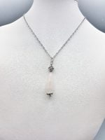 A necklace with ROSE QUARTZ DROP PENDANT pendant.