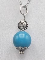 BLUE SPHERE AGATE PENDANT with a silver chain.