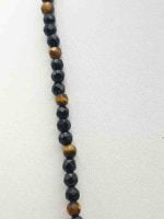 A MEN'S NECKLACE WITH BLACK ONYX AND TIGER'S EYE 4MM on a white surface.