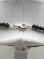 A MEN'S NECKLACE WITH BLACK ONYX AND TIGER'S EYE 4MM with silver clasp.