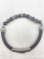 A MEN'S BRACELET WITH SODALITE AND TIGER'S EYE WITH LEATHER CORD with blue and silver beads and silver clasp.