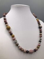 A RHODONITE AND MOOKAITE NECKLACE with pink, yellow and brown beads.