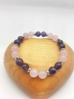 A pink and purple bracelet made with amethyst and rose quartz stones, diameter 8.