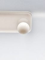 A white ceiling light with a white sphere on top, reminiscent of the WHITE AGATE EARRINGS.