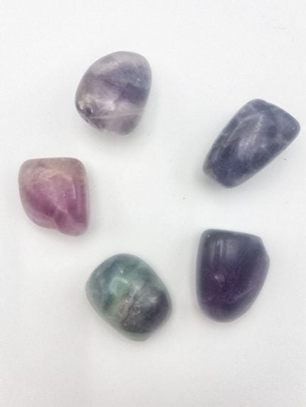 FLUORITE RAINBOW TUMBLED CRYSTALS - SET OF 5 with a touch of RAINBOW.