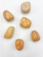 Group of stones YELLOW TUMBLED JASPER on a white background.