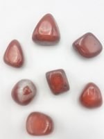Group of stones TUMBLED RED JASPER on a white background.
