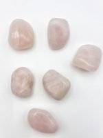 Five stones of TUMBLED ROSE QUARTZ on a white background.