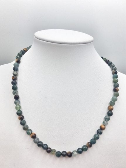 A MAN NECKLACE OF INDIAN AGATE with green and brown beads on mannequin.