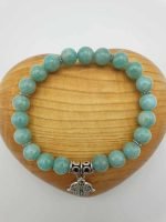AN AMAZONITE BRACELET with a green stone and a silver pendant.