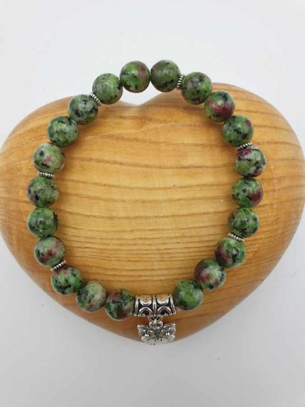 A RUBY ZOISITE BRACELET with green jasper pearls and a silver pendant.