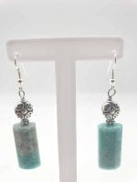 A pair of earrings with a stone EARRINGS WITH AMAZONITE BARREL.