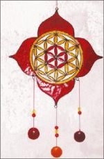 A LOTUS THE SEED OF LIFE SUNCATCHER thought-provoker featuring a stained glass design.