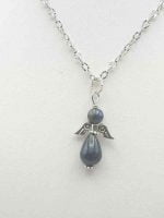 A silver lapis lazuli angel pendant with a blue pearl.