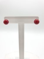 Pair of RED BAMBOO CORAL EARRINGS on white support.