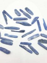 A bunch of KYANITE STICKS OR TUMBLED DISTENE blue crystals.