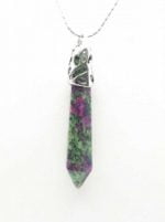 A Ruby Zoisite pendant on a silver chain.