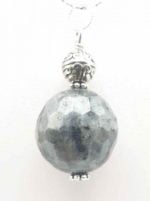 A silver labradorite pendant with a gray ball.