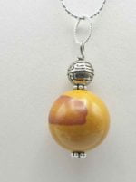 MOOKAITE PENDANT PENDANT necklace with yellow bead on silver chain.