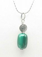 A pendant of green malachite on a silver chain.