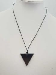 A female triangle shungite pendant on a black cord.
