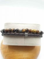 A MEN'S BRACELET WITH TIGER'S EYE, BROWN LEATHER CORD AND STEEL CLASP with brown leather cord and steel clasp.