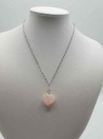 Rose quartz heart pendant pendant on mannequin.