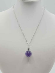 A purple sphere amethyst pendant pendant on a silver chain.