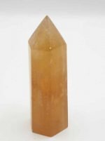 POINTED GOLDEN YELLOW CALCITE OBELISK on a white background.