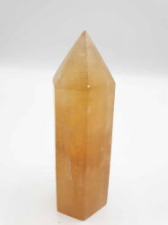 POINTED GOLDEN YELLOW CALCITE OBELISK on a white background.