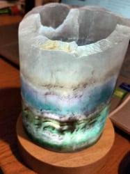 A rainbow fluorite led lamp with USB cable with a piece of quartz on top, infused with LED lighting and powered by a USB cable.
