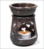 A Brucia essences Soapstone hearts oil heater with candle.