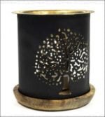 A black candle holder featuring a golden tree inspired by the Tree of Life, enriched with Aromafume Tree of Life Essence Burners.