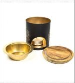 A black and gold candle holder with a golden cup perfect for Aromafume Tree of Life Essence Burners.