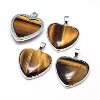 Three pendants TIGER'S EYE HEART PENDANT on white background.