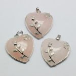 Three pink stone pendants ROSE QUARTZ HEART PENDANT WITH PLATED BRASS BEZELS with leaves on top.